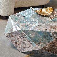 Table basse italienne minimaliste haut de gamme en forme de roche, taille salon moderne et simple en forme de lumière