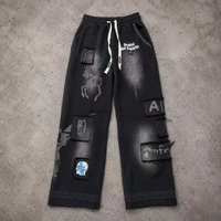 Pantalon large à cordon de serrage Kornit DTG, motif graphique vintage à lettrage ondulé et éclaboussures d'éclairs, entièrement imprimé, avec trous effilochés, coupe ample