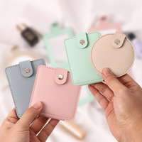 Vente en gros Mini miroir de maquillage de poche pliable portable Miroir de maquillage en cuir artificiel Grossissement 1X/2X Miroir de maquillage personnalisé pour femmes