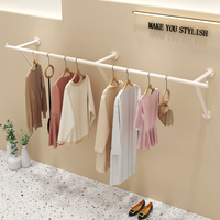 Porte-vêtements mural en métal blanc, barre de suspension pour vêtements, étagère de présentation pour boutique de vêtements féminins