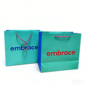 Sacs en papier de luxe bicolores bleu sarcelle et bleu avec logo personnalisé - Sacs d'emballage de marque imprimés à l'intérieur et à l'extérieur avec poignées en corde - Product Image 1