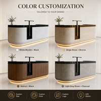 Comptoir de réception en marbre blanc avec plateau en marbre noir, éclairage LED, pour hôtel de luxe, vente en gros, directement de l'usine, logo personnalisé