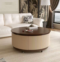 Table basse ronde élégante avec côtés cannelés, mécanisme de levage et rangement intégré