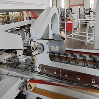 Machine automatique de collage et de couture de boîtes en carton ondulé