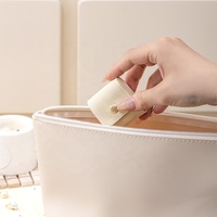 Sac à bijoux portable en microfibre avec fermeture à bouton, style sac à main européen-américain, pour bagues et accessoires de voyage