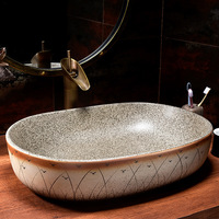 Jingdezhen Cerámica Arte Oem & Odm Hotel Moderno Fregadero Lavabo Setaria Patrón Forma ovalada Fregaderos de baño para la venta