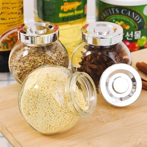 Mayorista 50ml 180ml 380Ml 480ML Frasco de especias de vidrio redondo plano con tapón de rosca plateado para almacenamiento de alimentos de nueces - Product Image 1