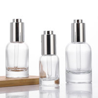 Flacon compte-gouttes en verre à base épaisse avec bouton poussoir 30ml 50ml, emballage de luxe pour sérum et huile essentielle avec boîte en papier