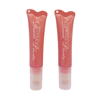 Tube cosmétique rose de 15 ml, tube de maquillage portable à presser avec trou de suspension, tête de massage en alliage de zinc doré pour crème pour les yeux et brillant à lèvres
