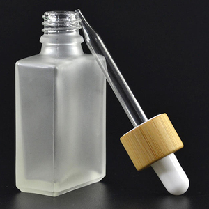 Frasco cuentagotas de botellas de vidrio transparente de aceite esencial de 30ml con tapa de Bambú - Product Image 1