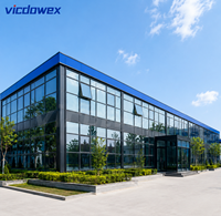 VICDOWEX Maison préfabriquée de luxe intégrée en forme de T avec fenêtres en aluminium pour usage commercial et bureautique contemporain