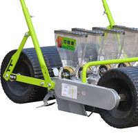 Petite machine manuelle de plantation de semoir de légumes d'ail de rangée de poussée de main de 4 pour des ventes