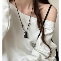 Collier pendentif noir atmosphérique, unisexe, style punk vintage, design, longue chaîne, accessoire tendance