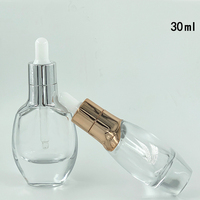 Flacon compte-gouttes en verre de luxe, emballage cosmétique pour soins de la peau, récipient en verre avec compte-gouttes à manchon d'épaule
