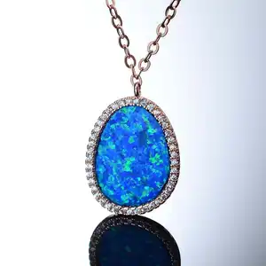 wholesale fashion 18k gold plated 925 sterling silver synthetic blue stone fire opal stone pendant with cz border