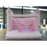Château gonflable commercial en PVC léger, rose et bleu, avec toboggan et aire de saut