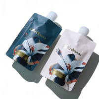 Ensemble de soins corporels floraux de luxe à base d'herbes biologiques, 2 pièces |   Pochette pour lotion corporelle et gommage |   Approvisionnement en gros OEM pour les voyages et les cadeaux pour enfants