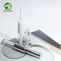 Tube de brillant à lèvres double embout transparent et électroplaqué au design populaire, emballage cosmétique vide en plastique en gros