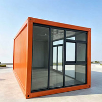Maisonnette Apple en acier ondulé orange, conteneur habitable avec mur entièrement vitré, double porte, mobilée pour bureau et espace de vie