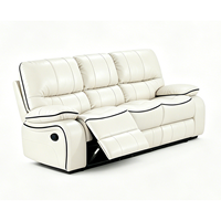 Ensemble de canapés inclinables Chesterfield en cuir tufté, design moderne haut de gamme, pour une décoration élégante de salon.