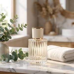 Vente en gros de flacons de <span class=keywords><strong>parfum</strong></span> en verre côtelé cylindriques de 30/50/100 ml <span class=keywords><strong>avec</strong></span> bouchon à col doré - <span class=keywords><strong>Flacon</strong></span> de <span class=keywords><strong>parfum</strong></span> <span class=keywords><strong>vide</strong></span> rechargeable - Product Image 1