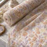 Tissu en maille/tulle respirant tricoté à motifs floraux pastel avec broderie de sequins, tons clairs, pour robe de mariée
