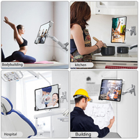 Support mural sécurisé pour tablette avec verrouillage, idéal pour les cours de yoga et l'utilisation éducative