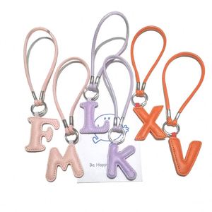 Porte-clés en cuir PU de haute qualité avec lettres anglaises, pendentif de sac en cuir souple et durable, porte-clés léger - Product Image 2