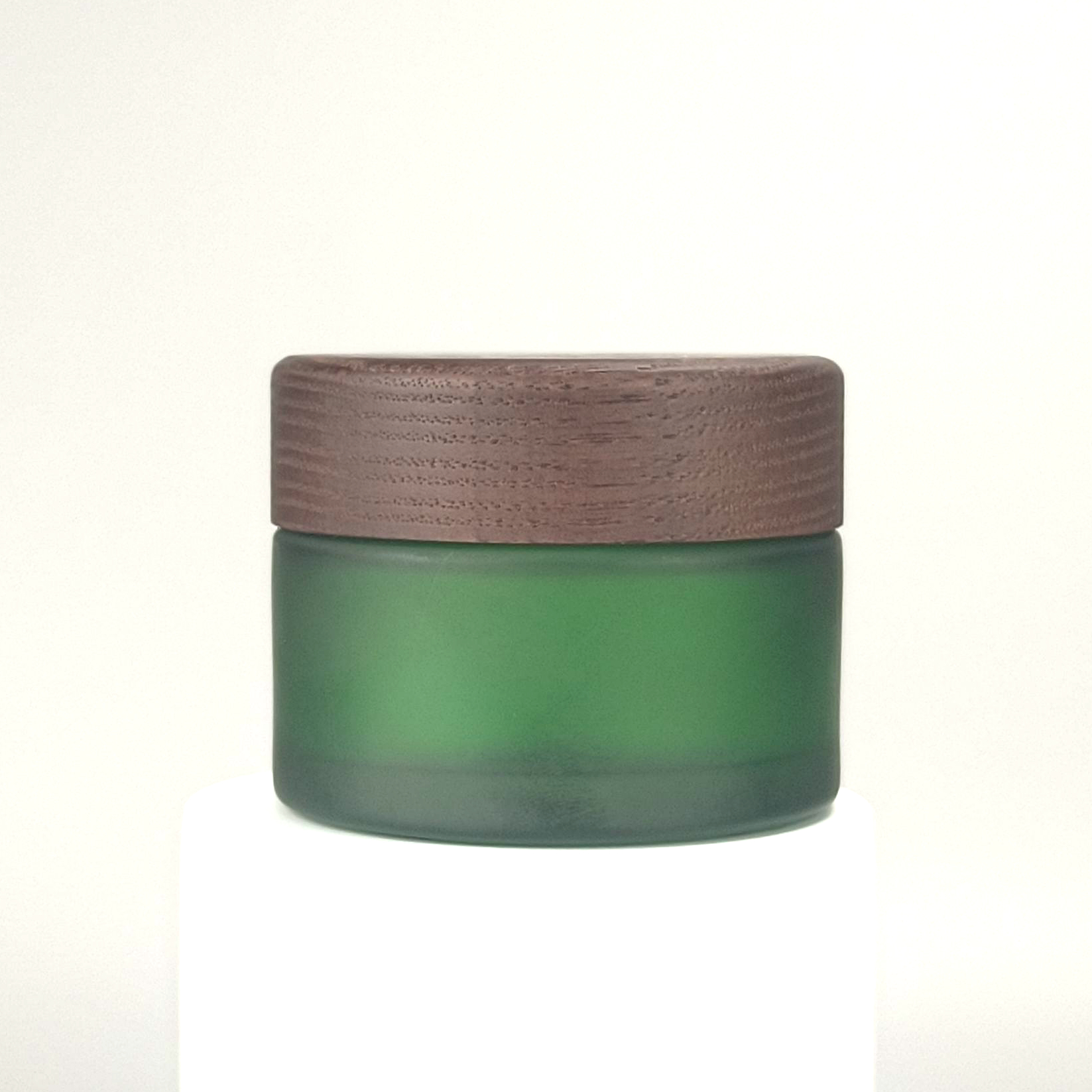 frosted green jar with dark color lid