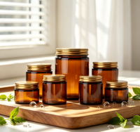 Vente en gros de pots cosmétiques en verre ambré avec couvercle en métal doré, contenants en verre vides pour bougies et crèmes, plusieurs tailles