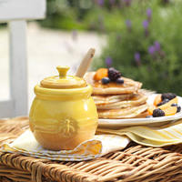 Pot de miel en céramique jaune avec louche pour le stockage des aliments et l'usine de conteneurs en gros 500ml