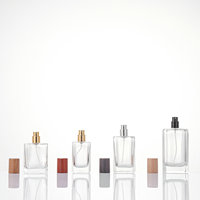 Flacons de parfum vides de luxe au design tendance 20ml/30ml/100ml, emballage en verre transparent carré à col serti avec pulvérisateur rechargeable