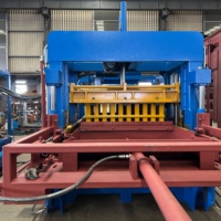 Machine à fabriquer des pavés en béton QT10-15 avec système d'alimentation automatique du matériau de face