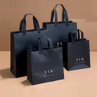 Sacs cadeaux noirs de luxe avec logo personnalisé sac en papier pour achats dans les magasins de détail sac de transport recyclable pour chaussures vêtements