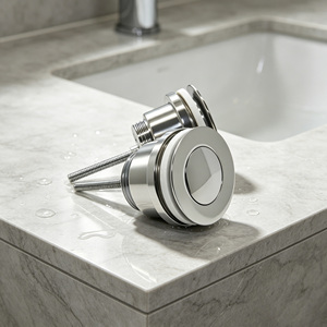Valvola di scarico a scomparsa in ottone cromato per lavabo, con pulsante a scatto, G1 1/4, tappo da 63mm, asta in acciaio inossidabile, molla anti-odore - Product Image 1