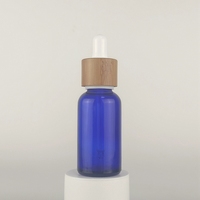 Flacon compte-gouttes en verre de 30 ml, flacon compte-gouttes résistant aux enfants de 1 oz, flacon d'huile essentielle bleu ambre avec compte-gouttes en bambou pour huile corporelle