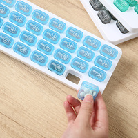 Boîte à pilules portable scellée en plastique style japonais créatif, type clavier, 31 compartiments, organisateur de comprimés pour la gestion de la santé