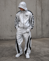 Ensemble de survêtement pour homme en satin blanc brillant laminé avec fermeture éclair, pantalon large à empiècements contrastants, style streetwear, vente en gros