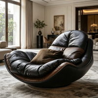 Fauteuil de loisirs individuel en cuir noir avec cadre en fibre de verre noir, coussin moelleux, idéal pour les espaces de vie modernes aux tons sombres