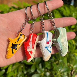 พวงกุญแจรูปรองเท้าไทเกอร์ 3 มิติ แบบโปร่ง รุ่นแฟชั่น  ของตกแต่งรูป<span class=keywords><strong>รองเท้า</strong></span>  จี้บรูซ <span class=keywords><strong>ลี</strong></span>  <span class=keywords><strong>รองเท้า</strong></span>กังฟูสีเหลือง  <span class=keywords><strong>รองเท้า</strong></span><span class=keywords><strong>ผ้าใบ</strong></span>ผู้ชาย - Product Image 2