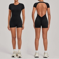 Traje de yoga de una pieza con abertura trasera amplia, elástico en cuatro direcciones, transpirable, ecológico, de spandex/nailon para ejercicio.