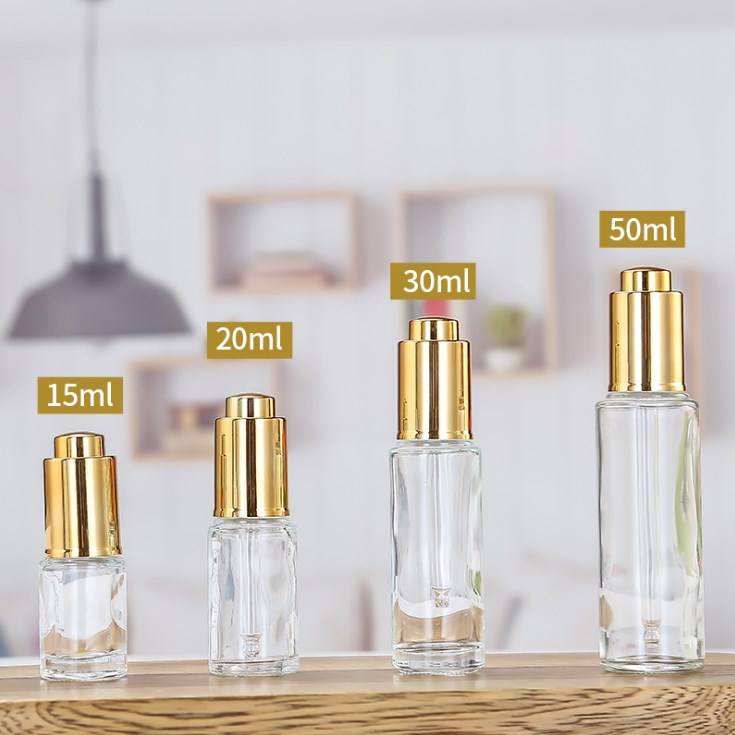 Clear bottle with gold tops