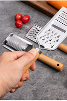 Manche en bois Gadgets de cuisine en acier inoxydable Râpe à fromage et légumes Trancheuse à mandoline sûre