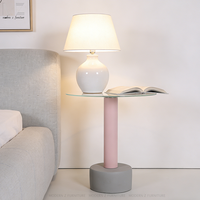 Table basse nordique moderne de luxe en pierre naturelle et en acier inoxydable doré avec dessus en bois rond noir