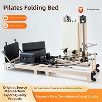Lit de Pilates pliable en érable pour studio de yoga avec ensemble de résistance à ressorts pour les programmes d'étirement et de tonification