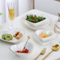 Assiette en céramique de style européen de luxe pour collations, table basse de salon, assiette à fruits, assiettes à dîner, ensemble en céramique de luxe avec bord doré