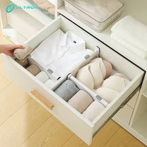 Divisor de cajón de plástico de doble resorte Diseño retráctil Superficie antisuciedad texturizada Divisores de organizador de cajón ajustable - Product Image 1