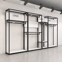 Présentoir de vêtements en métal noir avec logo personnalisé pour magasin de vêtements pour hommes, support de présentation de costumes pour hommes, présentoir de vêtements de vente au détail