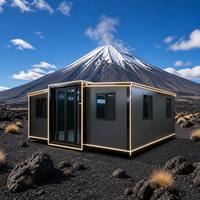Maison conteneur modulaire extensible à double aile avec éclairage LED, cabine noire, vue sur le volcan et la montagne, vente en gros OEM