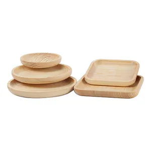 不同形状和尺寸的圆形和矩形北欧甜点橡胶木圆木托盘，带手柄